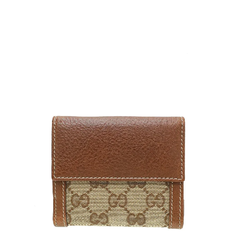 Women Gucci Sylvie bags featuring the signature web stripeGucci Bicolor GG Buckle Compact Wallet