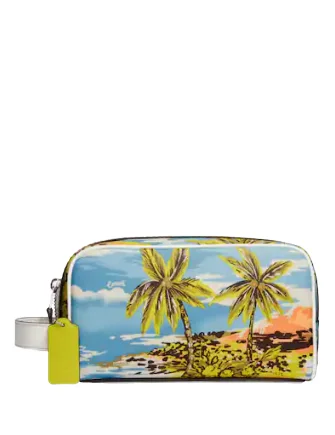 Coach Dempsey bags with a contrast - colored interior for visual interestCoach Small Travel Kit With Hawaiian Print