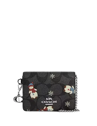 Ladies Coach Tabby bags with a textured leather surface for a more tactile lookCoach Boxed Mini Wallet On A Chain In Signature Canvas With Snowman Print