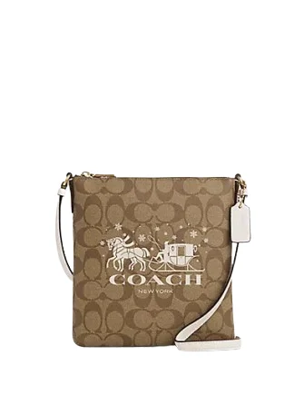 Coach crossbody bags with a printed floral pattern for a feminine touchCoach Mini Rowan File Bag In Signature Canvas With Horse And Sleigh