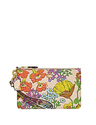 Coach bags with a zippered interior pocket for separating itemsCoach Small Wristlet With Floral Print