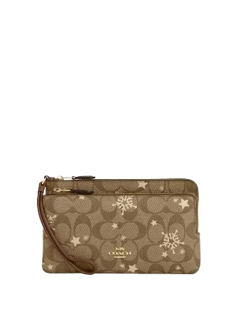 Coach Rogue bags with a detachable shoulder strap for versatile carryingCoach Double Zip Wallet In Signature Canvas With Star And Snowflake Print