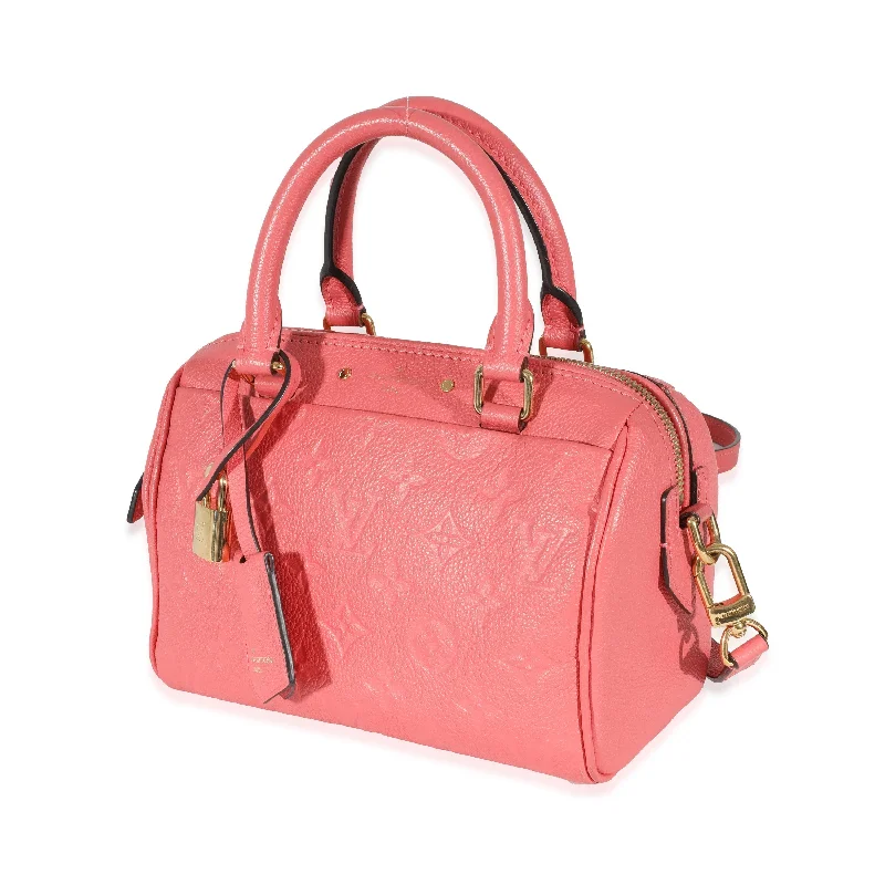 Louis Vuitton Twist bags with a contrast - colored interior for visual interestLouis Vuitton Pink Monogram Empreinte Speedy Bandoulière NM 20