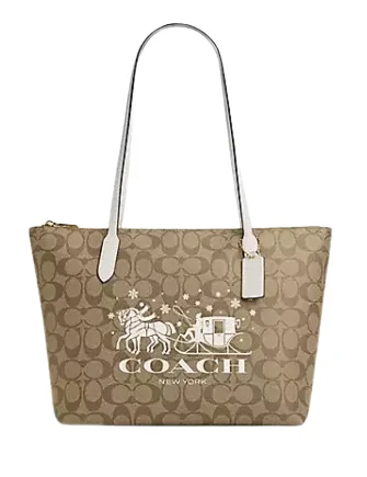 Ladies Coach shoulder bags with a tassel - decorated zipper for added charmCoach Zip Top Tote In Signature Canvas With Horse And Sleigh