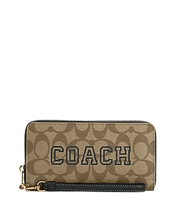 Coach bags with a front - flap pocket and a turnlock for a classic aestheticCoach Long Zip Around Wallet In Signature Canvas With Varsity Motif