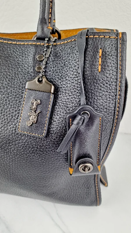 Coach Borough bags with a structured silhouette and a magnetic - snap closureCoach 1941 Rogue 31 Bag in Black Pebble Leather Honey Suede Coach 38124