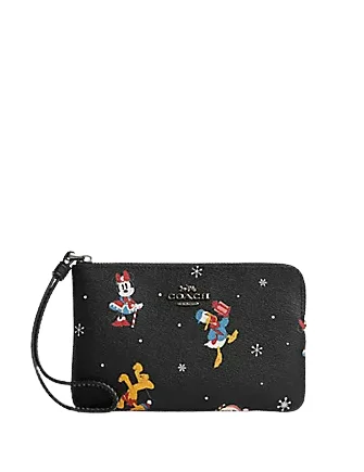 Ladies Coach shoulder bags with a magnetic - closure flap for easy accessCoach Disney X Coach Corner Zip Wristlet With Holiday Print