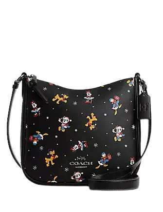 Coach Dempsey bags with a contrast - colored interior for visual interestCoach Disney X Coach Ellie File Bag With Holiday Print