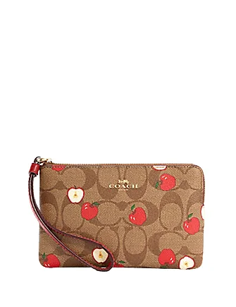 Coach tote bags with a printed Coach logo for brand visibilityCoach Corner Zip Wristlet In Signature Canvas With Apple Print