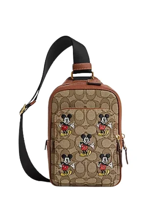 Coach handbags with a beaded trim for a glamorous and elegant lookCoach Disney X Coach Track Pack 14 In Signature Jacquard With Mickey Mouse Print