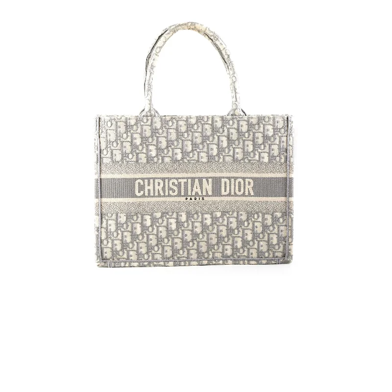 Christian Dior handbags with a snap - button closure and a decorative buckleDior Medium Book Tote Oblique Grey